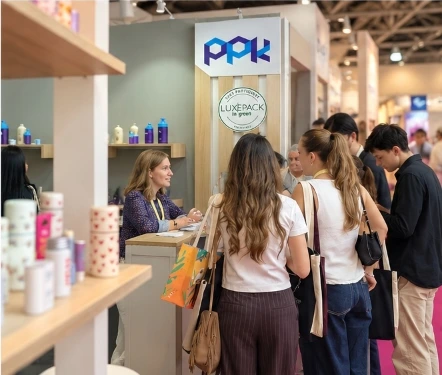Visitors exploring PPK sustainable packaging samples at Booth RB15